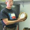 Andy staton showing one of his clocks.