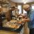 Ken cutting a portion of meat for a tasty meal.