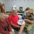 A glass dial clock that caused a problem on how to remove the hour hand without breaking the dial or hand. Bob Kleeman, Marcus Bush and guest (from r to l).